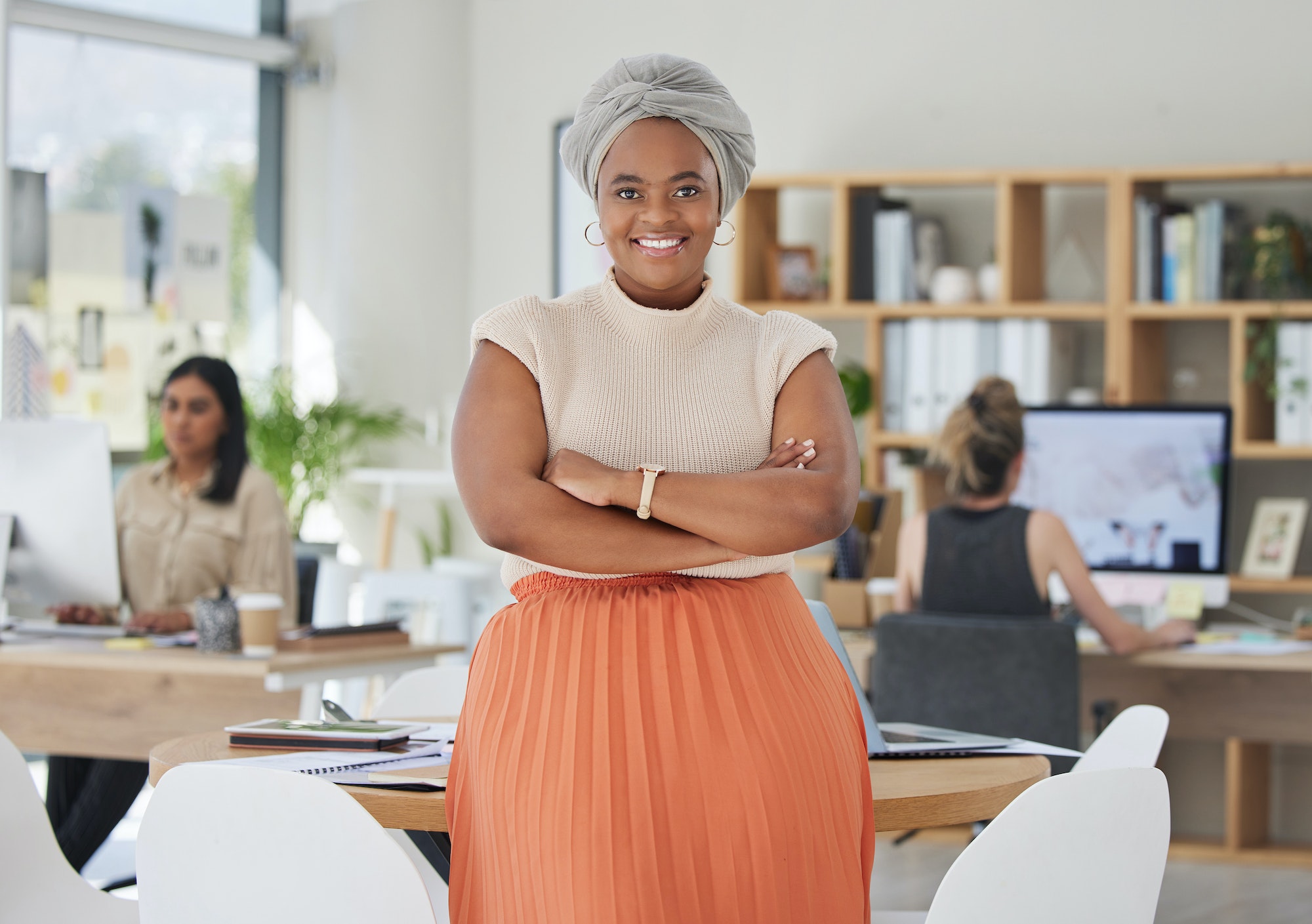 Innovation, leadership and a proud black business woman standing in power in a corporate office. Ha